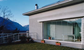 closed veranda with sliding, folding glass doors for outside